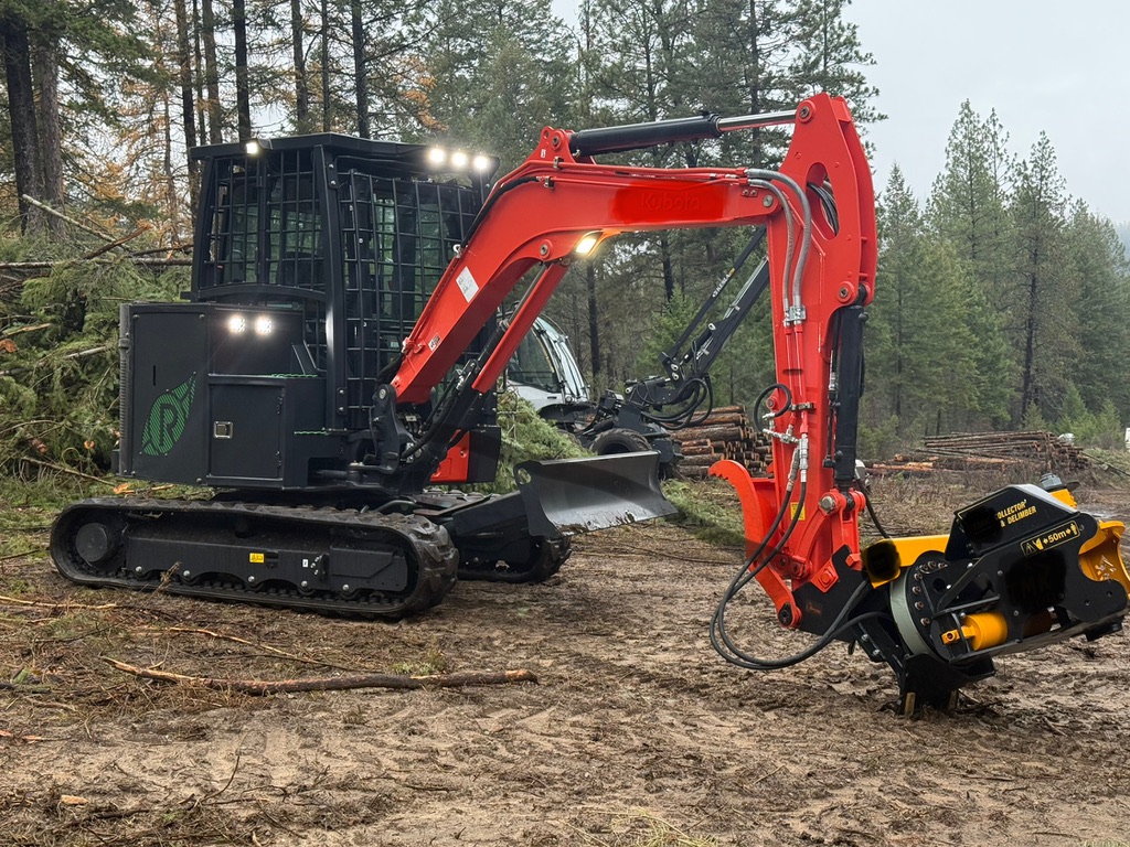 Kubota carrier fitted with a delimber head on a treatment block